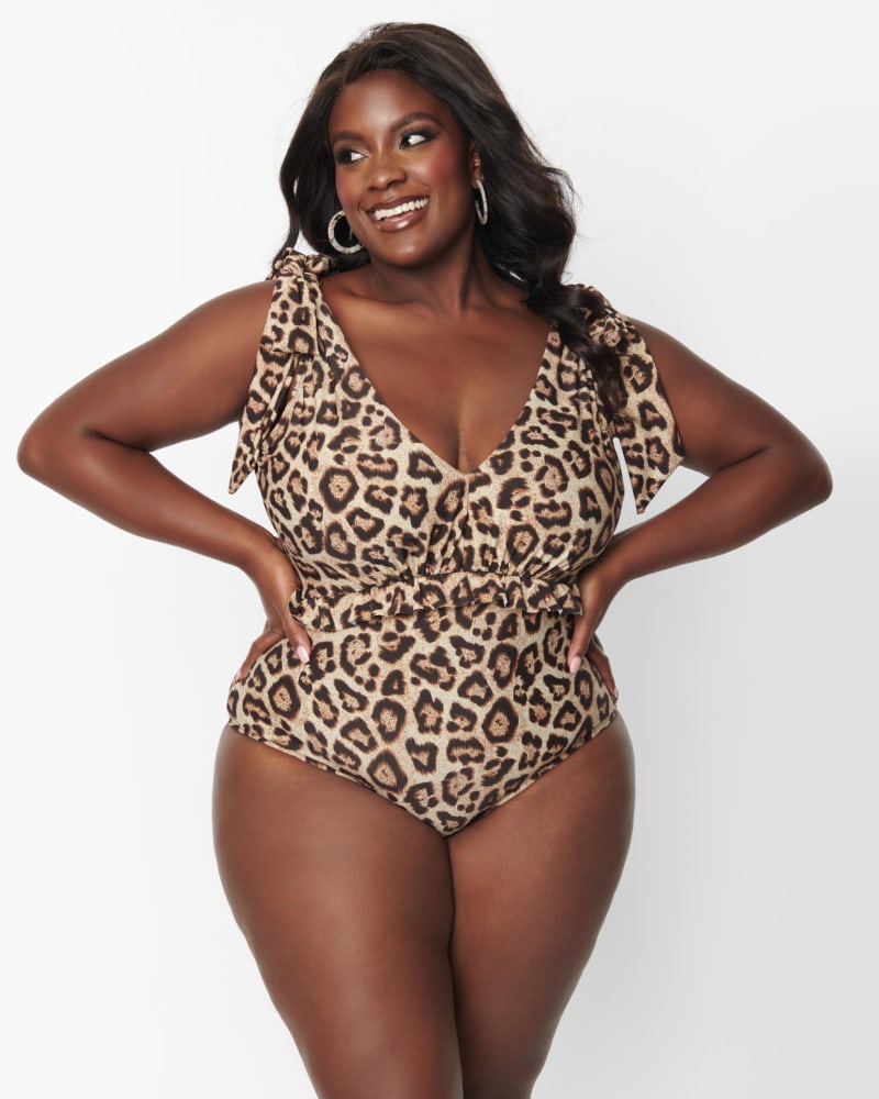 Front of a model wearing a size 2X Unique Vintage Leopard Print Plunge One Piece Swimsuit in Brown, Leopard by Unique Vintage. | dia_product_style_image_id:288792